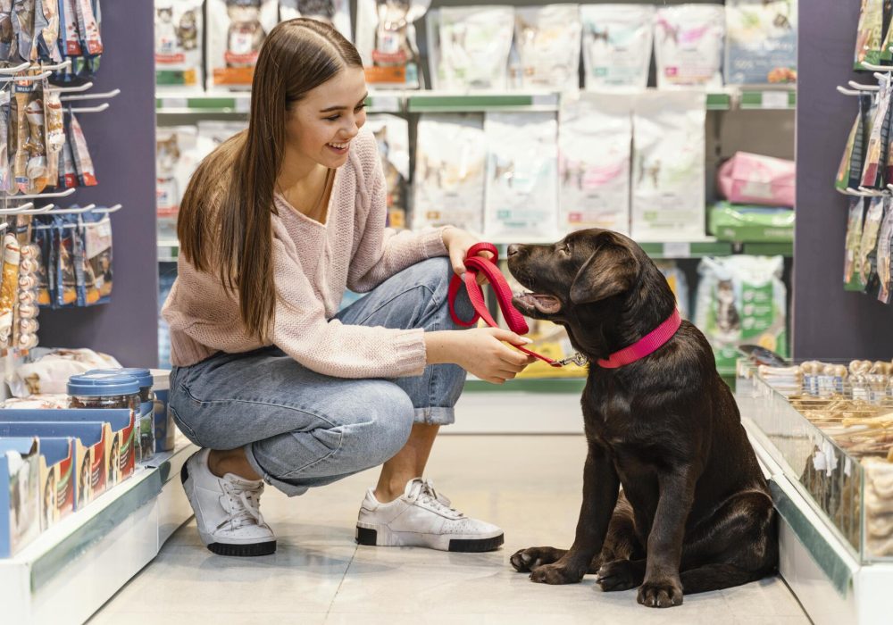 adorable-dog-with-female-owner-pet-shop